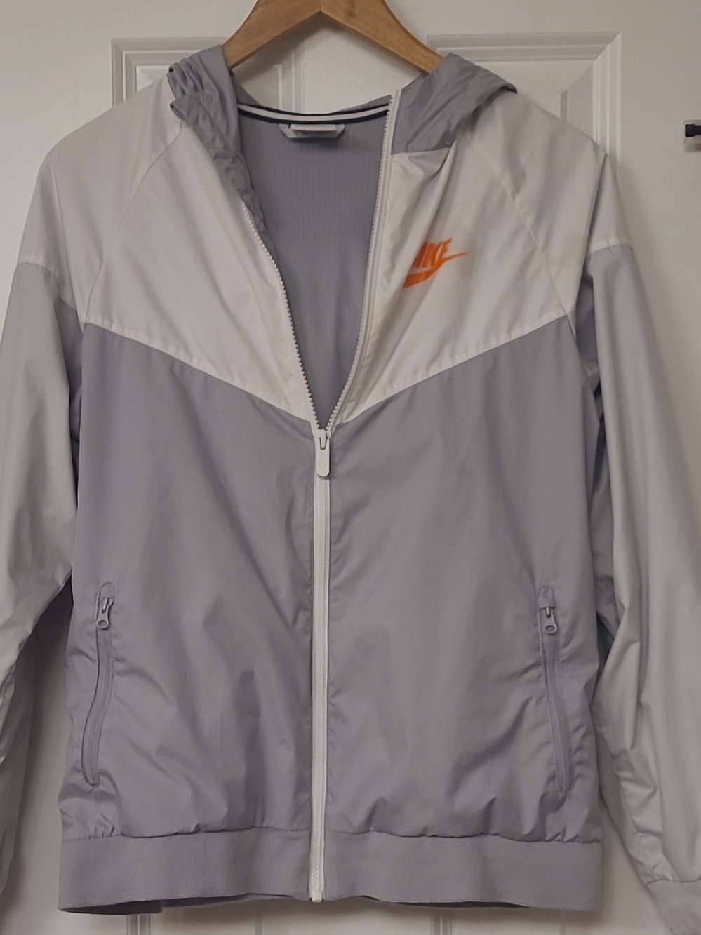 Nike Women's Light Gray and White Hooded Windbreaker with Orange Swoosh